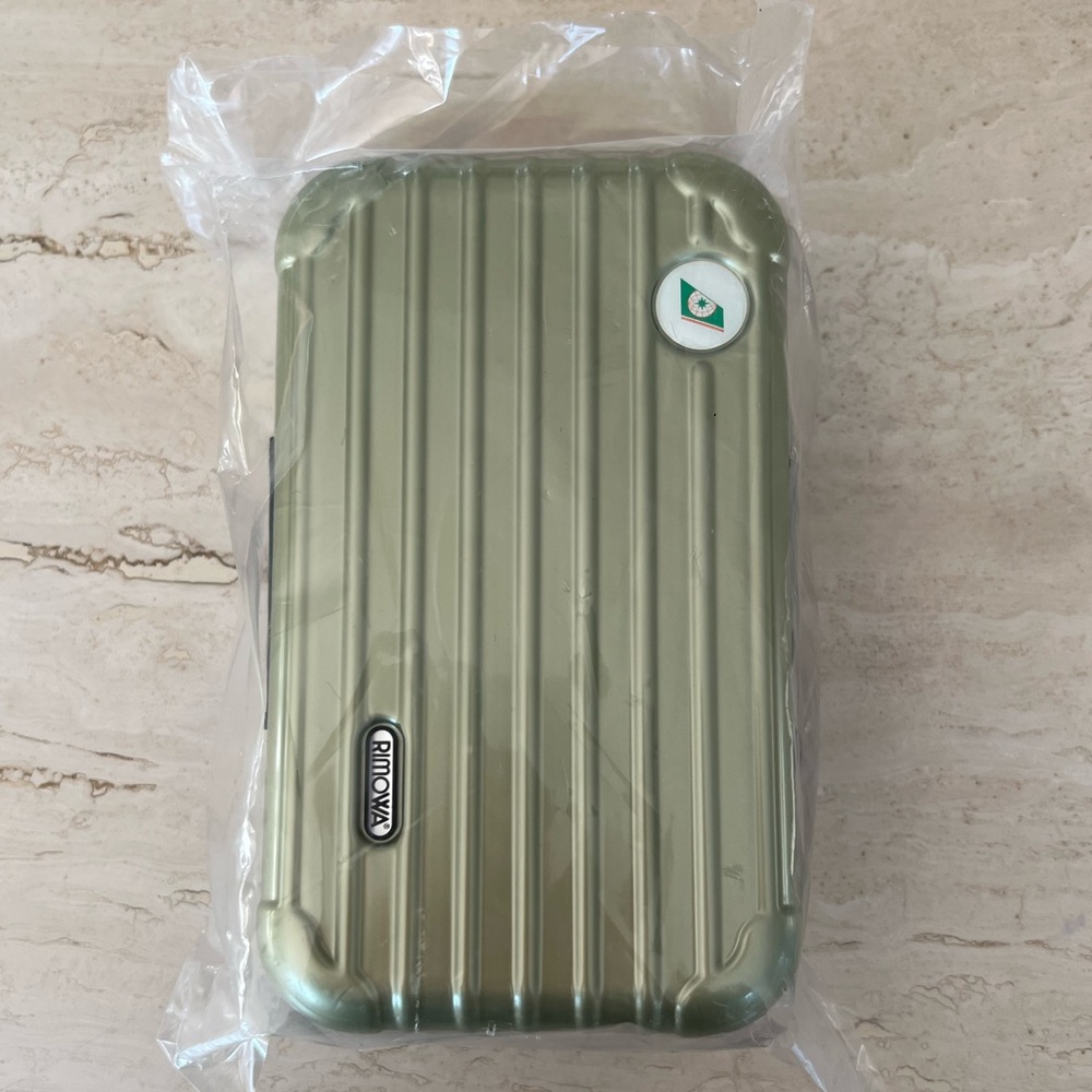 RIMOWA toiletry case from Eva Air in Metallic Light Olive Green
